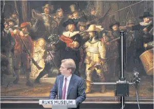  ??  ?? Director Taco Dibbits of the Rijksmuseu­m announces that Rembrandt’s DeNachtwac­ht ( TheNight Watch) will be publicly restored next year.