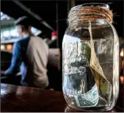  ?? Arkansas Democrat-Gazette/MITCHELL PE MASILUN ?? A couple extra bucks in the tip jar are always welcome to Arkansas Travelers organist Trey Trimble, who said he makes enough otherwise to pay for gas to travel to Travs’ games in North Little Rock.