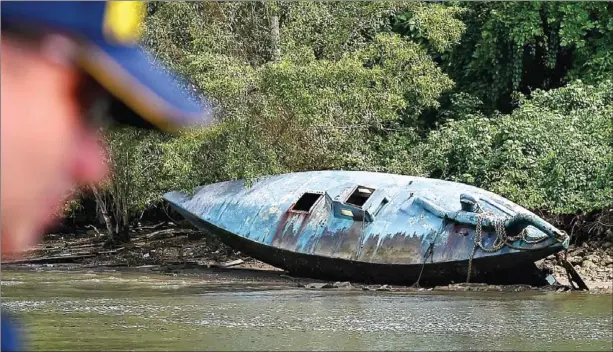  ?? AFP ?? A homemade narco-submarine that has been seized is seen at the seaport of the Colombian Coast Guard in Tumaco, Colombia, last month.