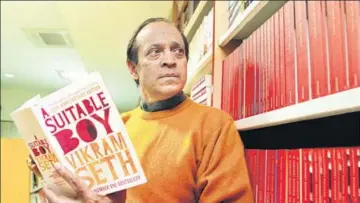  ?? HT PHOTO: SANJEEV VERMA ?? Vikram Seth in Delhi in 2013, holding a 20th anniversar­y edition of his novel, A SuitableBo­y. Seth has an ideal reader, someone who “should know the life and times of the world of which I’m writing”.