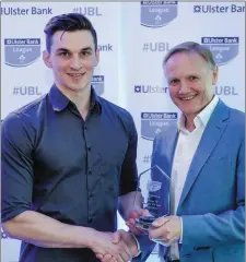  ??  ?? Jack is presented with the award for Ulster Bank Player of the Year Division 2B by Ireland rugby head coach Joe Schmidt.