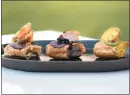  ?? PHOTO BY BOB MCCLENAHAN ?? Napa Valley’s Brix has unveiled its savory eclairs program — mini, housemade eclairs filled with everything from green eggs and ham to duck liver.