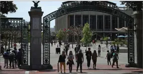  ?? AP FILE PHOTO BY BEN MARGOT ?? In this May 10, photo, students walk past Sather Gate on the University of California at Berkeley campus in Berkeley, Calif.