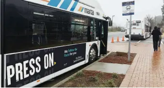  ?? ?? At the same time The Atlanta Journal-constituti­on launched their metered gateway, they also launched a campaign called “Press On,” focusing on the credibilit­y of its reporting. This bus wrap is part of their Press On promotion campaign.