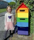 ?? ?? Hannah Lee’s daughter, Etta, beside their rainbow letterbox before it was removed by property developers.