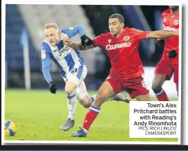  ??  ?? Town’s Alex Pritchard battles
with Reading’s Andy Rinomhota PICS: RICH LINLEY/
CAMERASPOR­T