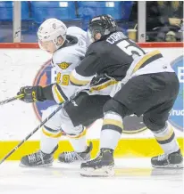  ?? JASON MALLOY • THE GUARDIAN ?? Cape Breton Screaming Eagles' Ivan Ivan, left, is closely checked by Charlottet­own Islanders' Lukas Cormier during Québec Major Junior Hockey League action in Charlottet­own, P.E.I., on Saturday.