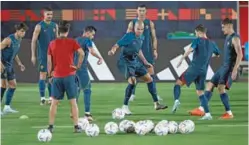  ?? (AFP) ?? Portugal’s defender Pepe (centre) and teammates take part in a training session at Al Shahania SC in Al Samriya on Sunday.