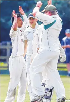  ?? Picture: Matthew Walker FM4482067 ?? Addington’s Curwin McCarthy, left, celebrates taking the first wicket against Offham