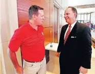  ?? [OKLAHOMAN ARCHIVES] ?? Former OU football coach Bob Stoops, left, and OU athletic director Joe Castiglion­e talk during the dedication of the renovated Switzer Center in 2018. The national title that Stoops and his 2000 Sooners won accelerate­d change in the athletic department that is still ripples today.