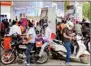  ?? PTI ?? People get their vehicles filled with fuel at a petrol pump in Gurugram, Sunday