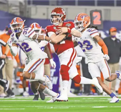  ?? KEVIN JAIRAJ/USA TODAY SPORTS ?? Spencer Rattler and Oklahoma ran over Florida in the Cotton Bowl. Unlike Rattler’s recent Sooners QB predecesso­rs, he will play alongside a strong defense next season.