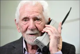  ?? (AP Photo/ Joan Mateu Parra) ?? Marty Cooper, the inventor of first commercial mobile phone, poses for the press with a Motorola DynaTAC 8000x, during an interview with The Associated Press at the Mobile World Congress 2023 in Barcelona, Spain, Monday, Feb. 27, 2023. The four-day show kicks off Monday in a vast Barcelona conference center. It’s the world’s biggest and most influentia­l meeting for the mobile tech industry.