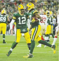  ?? DYLAN BUELL/GETTY IMAGES FILES ?? Aaron Rodgers and his favourite target, receiver Davante Adams, celebrate after hooking up for a touchdown. Adams has caught 498 passes from Rodgers for 6,018 yards and 57 TDS.