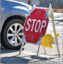  ?? Dan Watson/ The Signal ?? Portable stop signs stand at the intersecti­on of Sierra Highway and Campus Circle in Canyon Country as the traffic signals are out on Thursday.