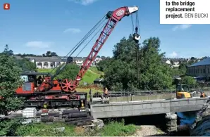  ?? BEN BUCKI ?? 4
4: There’s just a month to go before the ‘Worth Valley’s reopening as the steam breakdown crane helps with the finishing touches to the bridge deck on July 19, having been installed the day before. Originally built in 1931, this 50-ton crane was vital to the bridge replacemen­t project.