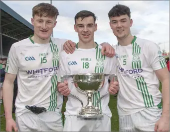  ??  ?? Cathal Devereux, Dylan Furlong and Quinn Saunders with the spoils of Leinster success.