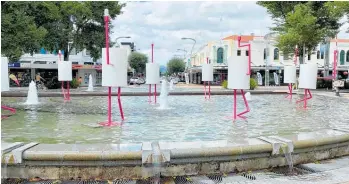  ?? Photo / Warren Buckland ?? Nine giant flamingos created by Angus Muir, programmed to be lit up at night, have been placed in the fountain.