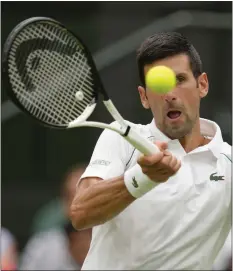  ?? AP ?? Novak Djokovic returns to Kwon Soonwoo in a men’s first round singles match at Wimbledon in London, Monday
