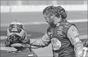  ?? Associated Press ?? Aiming for a repeat: Martin Truex Jr. removes his helmet after qualifying for the NASCAR Daytona 500 auto race at Daytona Internatio­nal Speedway earlier this week in Daytona Beach, Fla.