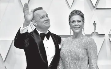  ?? AMY SUSSMAN/GETTY ?? Two-time Academy Award winner Tom Hanks and his actress-wife, Rita Wilson, tested positive for COVID-19.