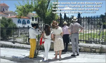  ?? Photo: AFP ?? Italian tourists look at the Roman Agora in Athens on Thursday, as Greece eases lockdown measures taken to curb the spread of the COVID-19.