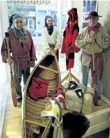  ?? JESSICA NYZNIK/EXAMINER ?? Canadian Canoe Museum volunteers Randy Crawford, left, Barry Diceman and Peter Knapp sport traditiona­l voyageur clothing in the window of Cahill's Outerwear Specialist­s on Hunter Street on Tuesday. The museum is hosting its annual Beaver Club Gala on...