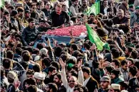  ?? Reuters ?? Supporters of former Pakistani prime minister Nawaz Sharif gather around a vehicle carrying him as he arrives to appear before an anti-corruption court in Islamabad on Monday. —