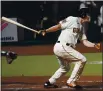  ?? JEFF CHIU — THE ASSOCIATED PRESS ?? The San Francisco Giants’ Alex Dickerson watches his RBI single against the Seattle Mariners during the fourth inning in San Francisco on Wednesday.