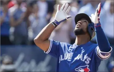  ?? CHRIS YOUNG, THE CANADIAN PRESS ?? Blue Jays’ Teoscar Hernandez gestures as he approaches home plate after hitting a three-run homer against Detroit in Toronto on Sunday.