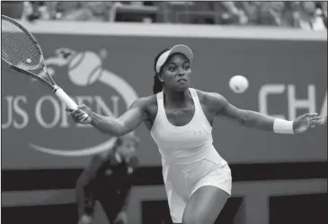  ?? The Associated Press ?? RETURN TO SENDER: Sloane Stephens returns a shot from Madison Keys during the women’s singles final of the U.S. Open tennis tournament Saturday in New York. Stephens beat Keys 6-3, 6-0 for her first Grand Slam title.