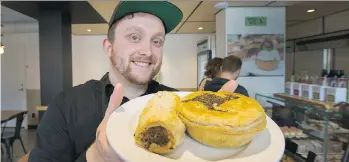  ?? ARLEN REDEKOP ?? Peaked Pies’ Josh Kennedy with The Hopper pie (with kangaroo meat) and a sausage roll.