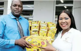  ?? Picture: FREDLIN ADRIAAN ?? WELCOME SUPPORT: Mfesane Senior Secondary School principal Sakhiwo Nombewu, left, was grateful to receive the donations from the Eastern Cape Liquor Board, represente­d by CEO Dr Mbuyi Makala