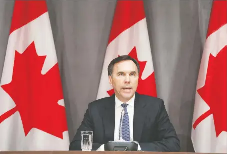 ?? DAVE CHAN/AFP VIA GETTY IMAGES ?? Canada’s Finance Minister Bill Morneau speaks during a news conference on Parliament Hill last week. The federal government is under pressure to deploy tens of billions of dollars to put companies — even entire industries — on life support while government­s effectivel­y power down non-essential elements of the global economy to stop the spread of COVID-19, Kevin Carmichael writes.