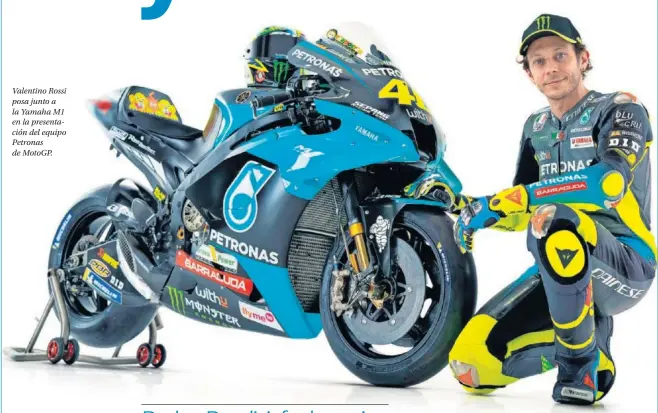  ??  ?? Valentino Rossi posa junto a la Yamaha M1 en la presentaci­ón del equipo Petronas de MotoGP.