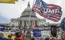  ?? Evelyn Hockstein / Washington Post contributo­r ?? Supporters of President Donald Trump storm the Capitol while Congress was meeting to certify Joe Biden’s election victory.