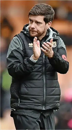  ?? ?? ALL SQUARE: Port Vale manager Darrelll Clarke, above, saw his side draw 1-1 with Bradford at the weekend after taking the lead, left.