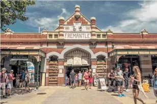  ?? Photos / Fremantle Tours, Tourism Western Australia, Visit Fremantle, Mike Yardley ?? The bustling Fremantle Markets have been trading since the 19th Century; my amazing tour guide Michael Deller; the La Sosta Italian restaurant; popular diner Bathers Beach House; the High Street is packed with heritage buildings.