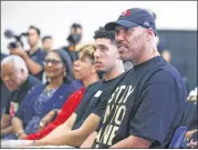  ?? JAE C. HONG / AP ?? LaVar Ball (right), father of Los Angeles Lakers draft pick Lonzo Ball, listens to his son during the NBA basketball team’s news conference in El Segundo, Calif.