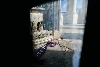  ?? Photograph: Shawn Thew/EPA ?? Shattered reinforced glass and debris litter the East steps in the US Capitol.