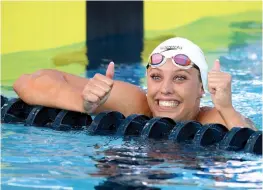  ?? AFP ?? Kathleen Baker celebrates her win in a new world record time of 58.00 seconds in the women’s 100 metre backstroke final in the National Swimming Championsh­ips at the Woollett Aquatics Center in Irvine, California, on Saturday. —