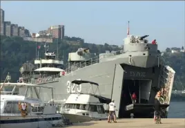  ?? Darrell Sapp/Post-Gazette ?? A World War II LST pulls into the wharf on the North Shore. The oceangoing LSTs were produced quickly in Amridge and Neville Island.