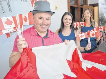  ?? DAVE STEWART/THE GUARDIAN ?? The City of Charlottet­own is already into the Canada Day spirit and is hoping that residents will be, too, even though things are going to be different this year. From left, are Wayne Long, events developmen­t officer, Laurel Lea, tourism officer, and Charlotte Nicholson, tourism events co-ordinator.