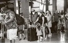  ?? Elizabeth Ruiz / Getty Images ?? Tourists are evacuated from their hotel in Puerto Morelos, Mexico, in preparatio­n for the arrival of Hurricane Delta.