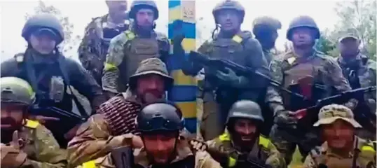  ?? ?? Victory: Ukrainian troops celebrate after pushing the invaders out of Kharkiv and all the way to the Russian border