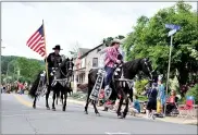  ?? SARAH STIER ?? A group of people riding horses in the VFW 56th Annual Parade in Mohnton on May 30, 2016. The 2021 parade has been canceled because of the coronaviru­s pandemic.