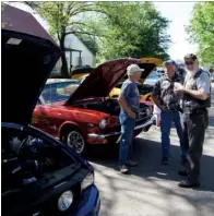  ?? RIVER VALLEY & OZARK EDITION FILE PHOTO ?? From left, Rich Tagio of Perryville, Jay Davis of Benton and Flip Young of Bigelow admire the cars at the 2016 Fourche River Days Car and Truck Show in Perryville.
