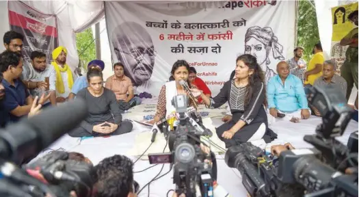  ?? Agence France-presse ?? Swati Maliwal, chairperso­n of the Delhi Commission for Women, speaks to the media during her hunger strike demanding the immediate implementa­tion of a stringent law to punish convicted rapists in New Delhi on Saturday. Maliwal said she would continue...