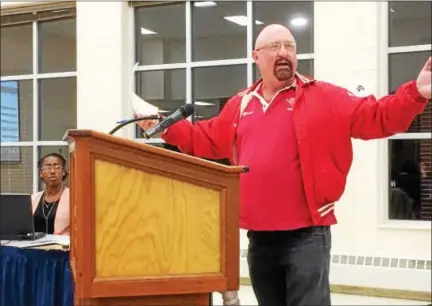  ?? EVAN BRANDT — DIGITAL FIRST MEDIA ?? Jeff Moses outlines what he says are alternativ­es to ending the 59-year tradition of the Pottstown/OJR Thanksgivi­ng Day football game during the Nov. 16 school board meeting.