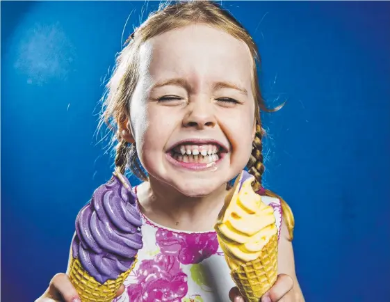  ?? Picture: JERAD WILLIAMS ?? Amelia Young trying Frosty Boy's new flavoured ice cream, ube (purple yam) and cheese.